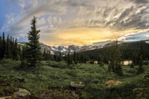 Evening In The Wilds. Glorious pastel Rocky Mountain sunset leaving golden hues on Long Lake in the Indian Peaks Wilderness, Boulder County Colorado. Glorious pastel Rocky Mountain sunset leaving golden hues on Long Lake in the Indian Peaks Wilderness, Boulder County Colorado