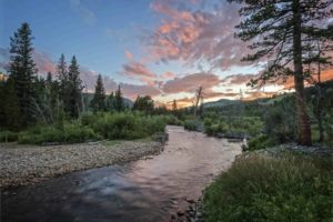 Summer Evening Bliss. Tranquil summer sunset over a cool mountain stream winding through Rocky Mountain eastern foothills in Boulder County Colorado. Tranquil summer sunset over a cool mountain stream winding through Rocky Mountain eastern foothills in Boulder County Colorado