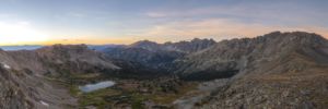 Arapaho Evening. Panoramic landscape photograph of pastel sunset over Caribou Lake taken above Arapaho Pass looking at Indian Peaks Wilderness Colorado. Panoramic landscape photograph of pastel sunset over Caribou Lake taken above Arapaho Pass looking at Indian Peaks Wilderness Colorado